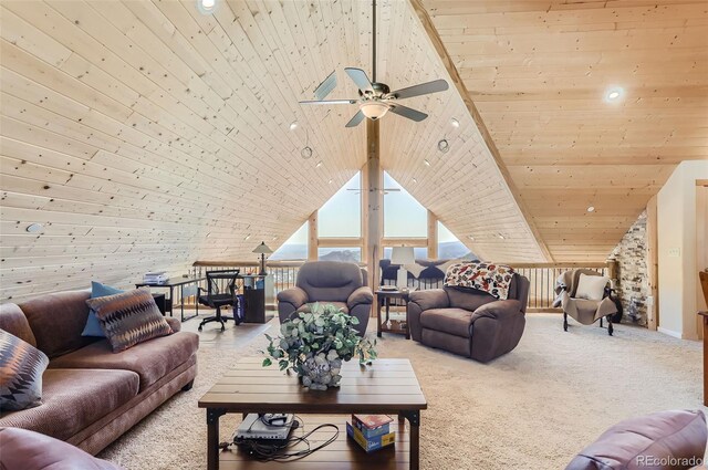 living room with a skylight, wood ceiling, ceiling fan, carpet floors, and high vaulted ceiling