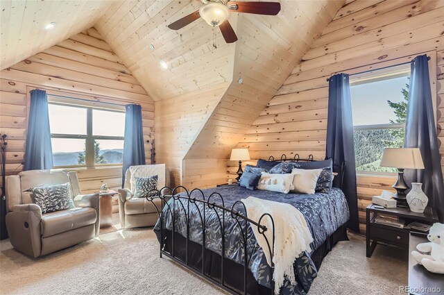 carpeted bedroom featuring vaulted ceiling, multiple windows, and ceiling fan