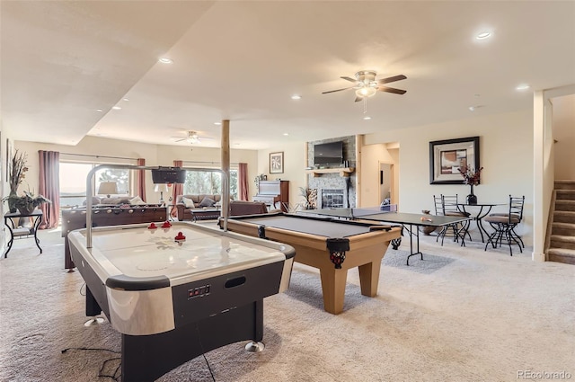 recreation room with recessed lighting, ceiling fan, a fireplace, and light colored carpet