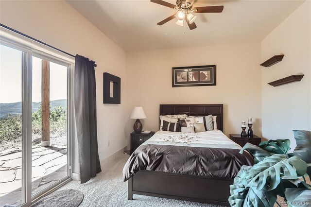 bedroom featuring light carpet, access to exterior, and ceiling fan