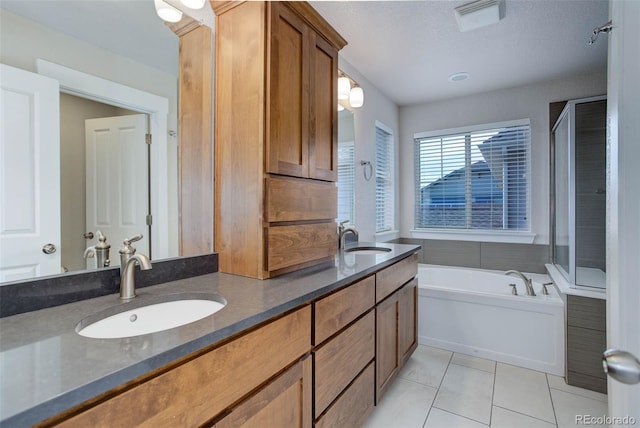 bathroom with vanity, plus walk in shower, and tile patterned flooring