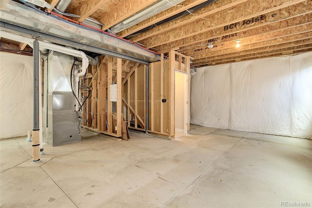 basement featuring heating unit