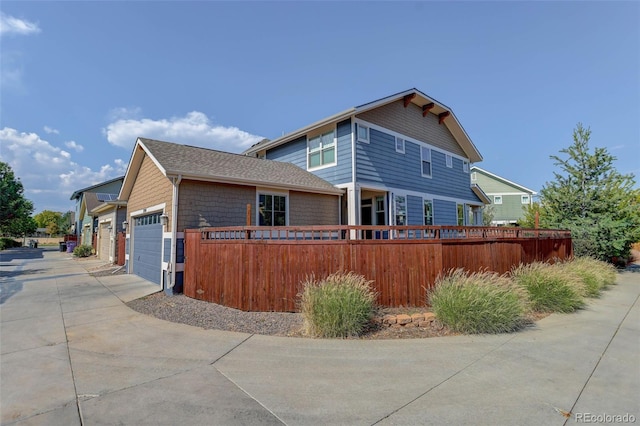 view of side of home featuring a garage