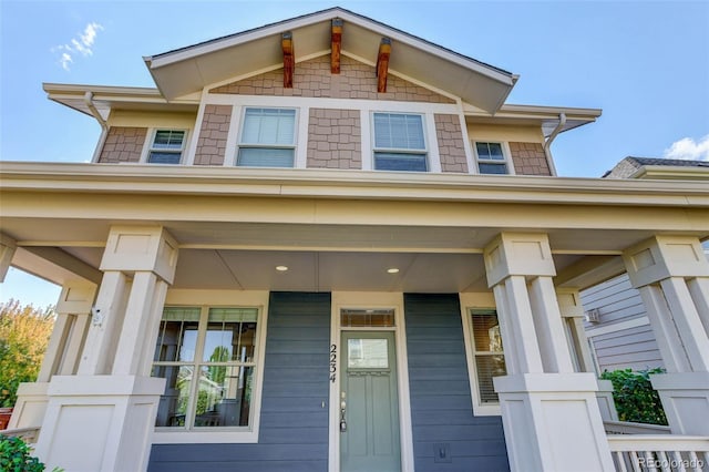 doorway to property with a porch