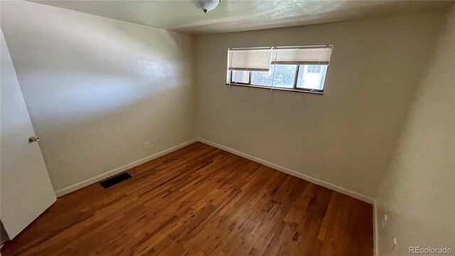 1160 Yosemite St, Denver, CO 80220 - spare room with wood-type flooring