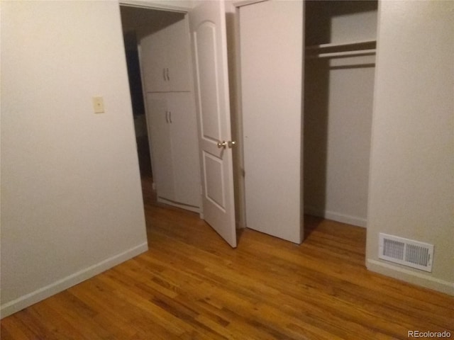 1160 Yosemite St, Denver, CO 80220 - unfurnished bedroom featuring light wood-type flooring and a closet