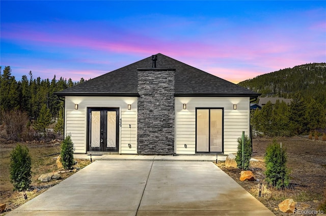 499 Silver Creek Rd, Idaho Springs, CO 80452 - view of front facade featuring french doors and roof with shingles
