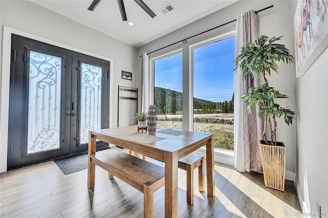 499 Silver Creek Rd, Idaho Springs, CO 80452 - dining space featuring french doors, plenty of natural light, light wood-style flooring, and recessed lighting