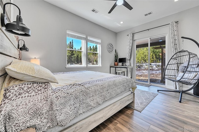 499 Silver Creek Rd, Idaho Springs, CO 80452 - bedroom featuring access to outside, multiple windows, recessed lighting, wood finished floors, and a ceiling fan