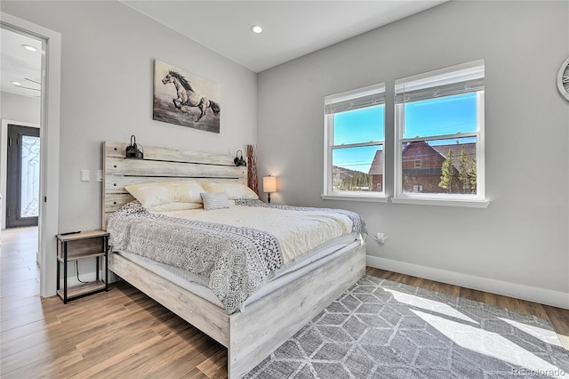 499 Silver Creek Rd, Idaho Springs, CO 80452 - bedroom with wood finished floors, baseboards, and recessed lighting