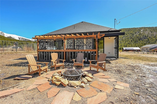 499 Silver Creek Rd, Idaho Springs, CO 80452 - view of patio / terrace featuring an outdoor fire pit, a pergola, and a mountain view