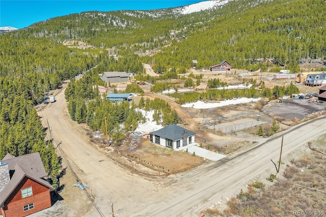 499 Silver Creek Rd, Idaho Springs, CO 80452 - bird's eye view of a heavily wooded area and a mountain backdrop