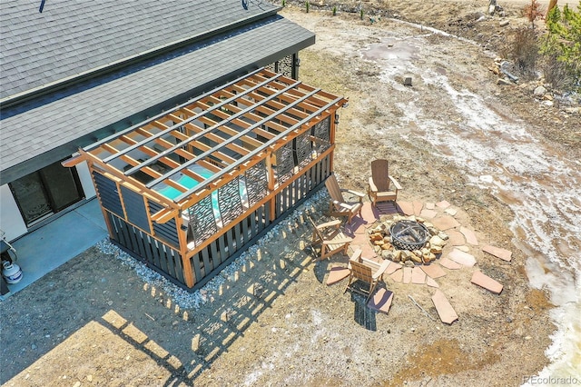 499 Silver Creek Rd, Idaho Springs, CO 80452 - exterior view of a fire pit and a shingled roof