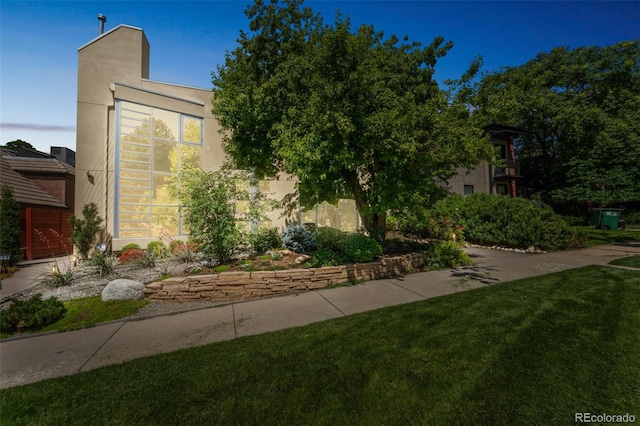 461 Fillmore St, Denver, CO 80206 - view of front of property with a front lawn and stucco siding