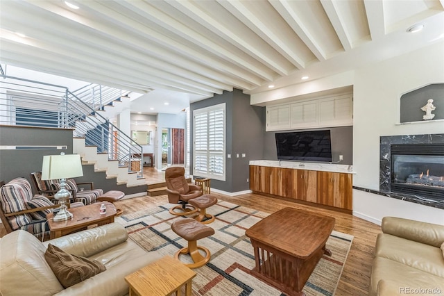 461 Fillmore St, Denver, CO 80206 - living room featuring light wood-type flooring, stairway, and a high end fireplace