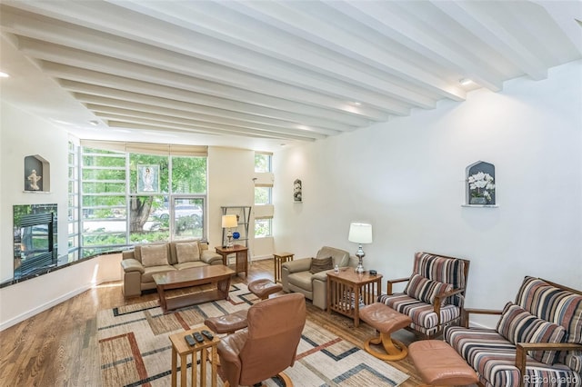 461 Fillmore St, Denver, CO 80206 - living area featuring a fireplace, wood finished floors, and beamed ceiling