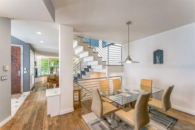 461 Fillmore St, Denver, CO 80206 - dining space with stairway, wood finished floors, and recessed lighting