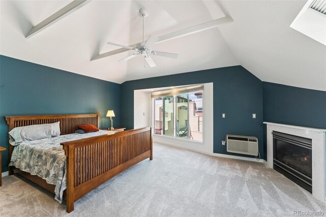461 Fillmore St, Denver, CO 80206 - bedroom featuring carpet, vaulted ceiling, a wall mounted AC, a ceiling fan, and a glass covered fireplace