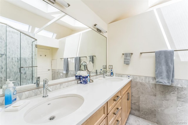 461 Fillmore St, Denver, CO 80206 - bathroom with double vanity, a shower with shower door, and tile walls