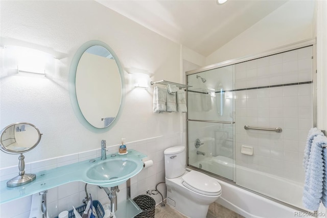 461 Fillmore St, Denver, CO 80206 - bathroom with combined bath / shower with glass door, vaulted ceiling, and tile walls