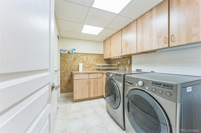 461 Fillmore St, Denver, CO 80206 - laundry area featuring washer and clothes dryer and cabinet space