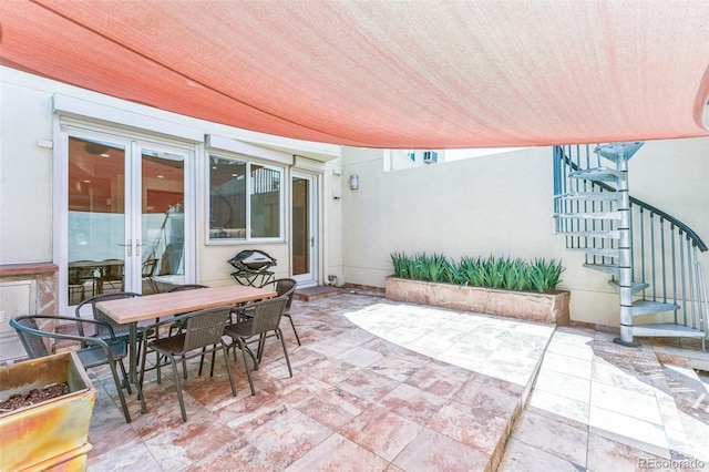461 Fillmore St, Denver, CO 80206 - view of patio featuring stairs, french doors, and outdoor dining space