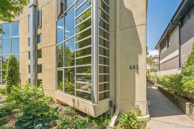 461 Fillmore St, Denver, CO 80206 - view of side of home featuring stucco siding