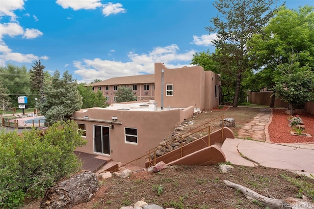 13 Crystal Park Rd, Manitou Springs, CO 80829 - back of property with stucco siding