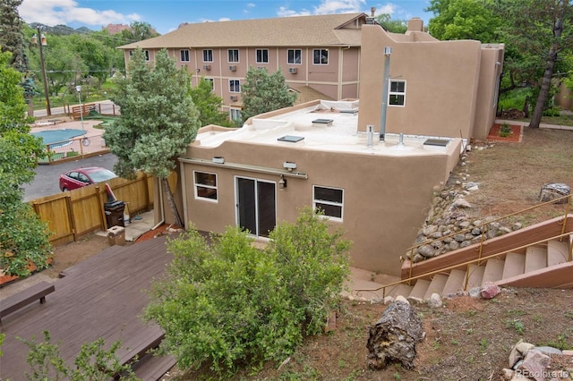 13 Crystal Park Rd, Manitou Springs, CO 80829 - back of house with stucco siding and a wooden deck
