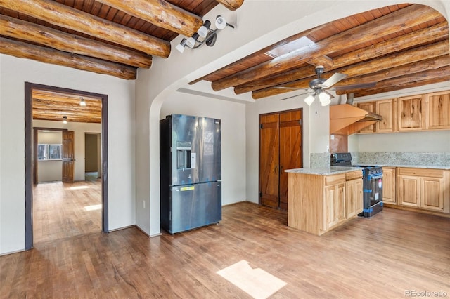 13 Crystal Park Rd, Manitou Springs, CO 80829 - kitchen featuring stainless steel appliances, a wooden ceiling with exposed beams, light brown cabinets, arched walkways, and wood finished floors