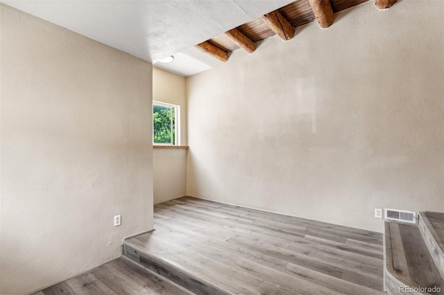 13 Crystal Park Rd, Manitou Springs, CO 80829 - empty room with beam ceiling and wood finished floors