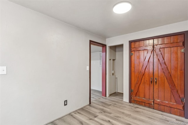 13 Crystal Park Rd, Manitou Springs, CO 80829 - unfurnished bedroom featuring light wood-type flooring