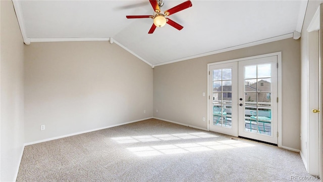 carpeted empty room with french doors, a ceiling fan, and ornamental molding