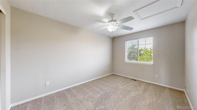 empty room featuring baseboards, visible vents, ceiling fan, and carpet