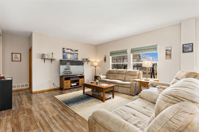 living area featuring wood finished floors and baseboards