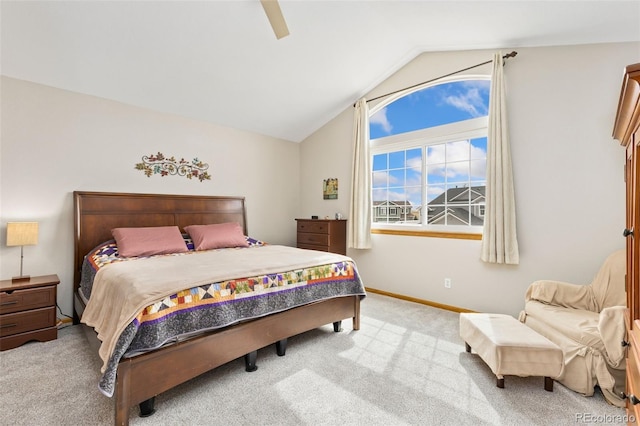 bedroom with carpet flooring, lofted ceiling, ceiling fan, and baseboards