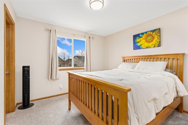 bedroom with carpet flooring and baseboards