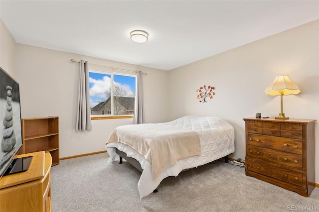 bedroom featuring carpet flooring and baseboards