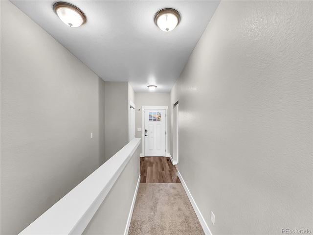 corridor with carpet floors