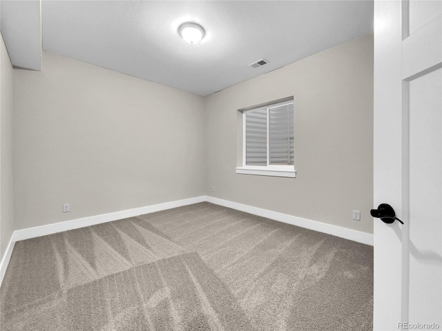 empty room featuring carpet floors