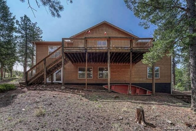 14694 Crooked Trail Rd, Woodland Park, CO 80863 - back of property featuring a deck and stairs