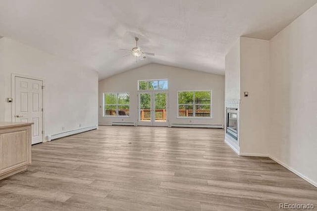 14694 Crooked Trail Rd, Woodland Park, CO 80863 - unfurnished living room featuring ceiling fan, baseboard heating, lofted ceiling, light wood-style flooring, and a baseboard heating unit