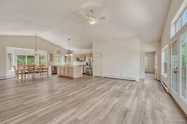 14694 Crooked Trail Rd, Woodland Park, CO 80863 - unfurnished living room featuring a baseboard heating unit, a baseboard radiator, high vaulted ceiling, light wood-style floors, and a ceiling fan