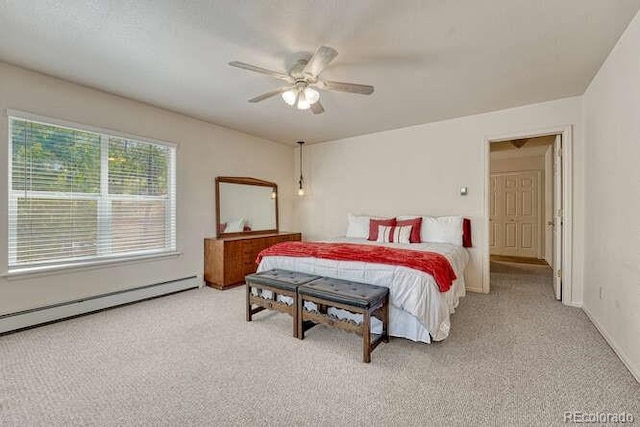 14694 Crooked Trail Rd, Woodland Park, CO 80863 - carpeted bedroom featuring a ceiling fan and a baseboard radiator