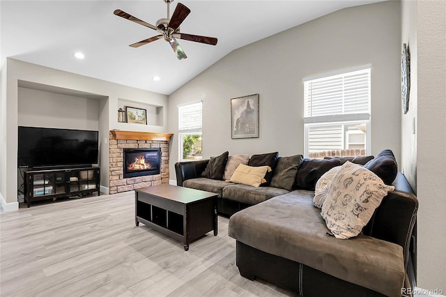 12585 S Beaver Creek Way, Parker, CO 80134 - living room featuring lofted ceiling, a ceiling fan, light wood-type flooring, a fireplace, and recessed lighting