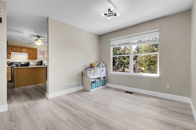 12585 S Beaver Creek Way, Parker, CO 80134 - empty room with light wood-style floors and a ceiling fan