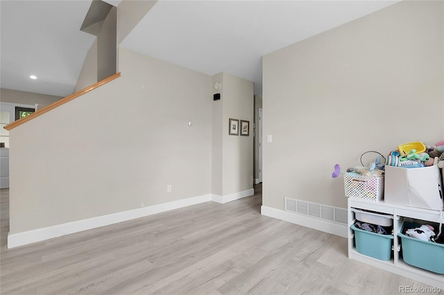 12585 S Beaver Creek Way, Parker, CO 80134 - unfurnished room with light wood finished floors, recessed lighting, and stairway