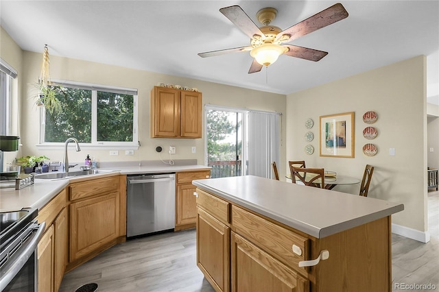 12585 S Beaver Creek Way, Parker, CO 80134 - kitchen featuring appliances with stainless steel finishes, light wood-style floors, a ceiling fan, and light countertops