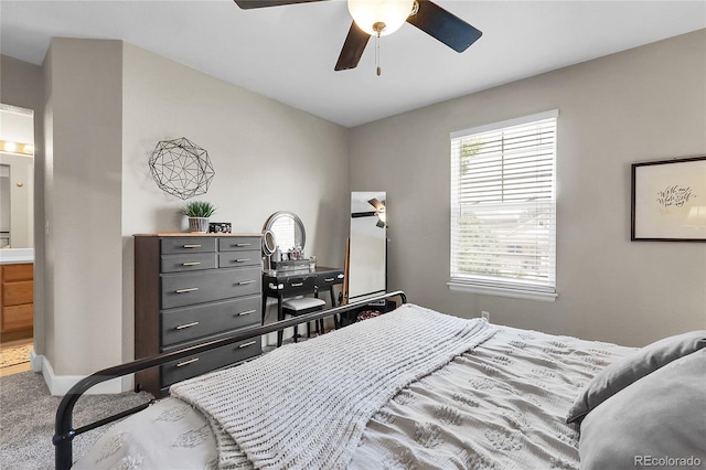 12585 S Beaver Creek Way, Parker, CO 80134 - carpeted bedroom featuring connected bathroom and a ceiling fan