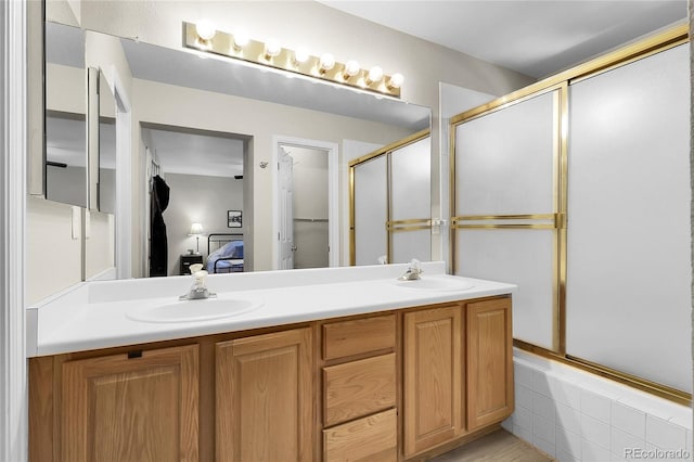 12585 S Beaver Creek Way, Parker, CO 80134 - ensuite bathroom featuring a shower with door and double vanity